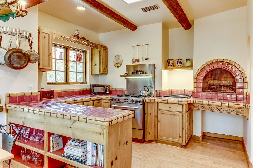Kitchen with wood burning fireplace.