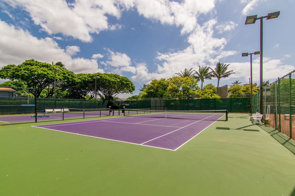 Two lit tennis courts