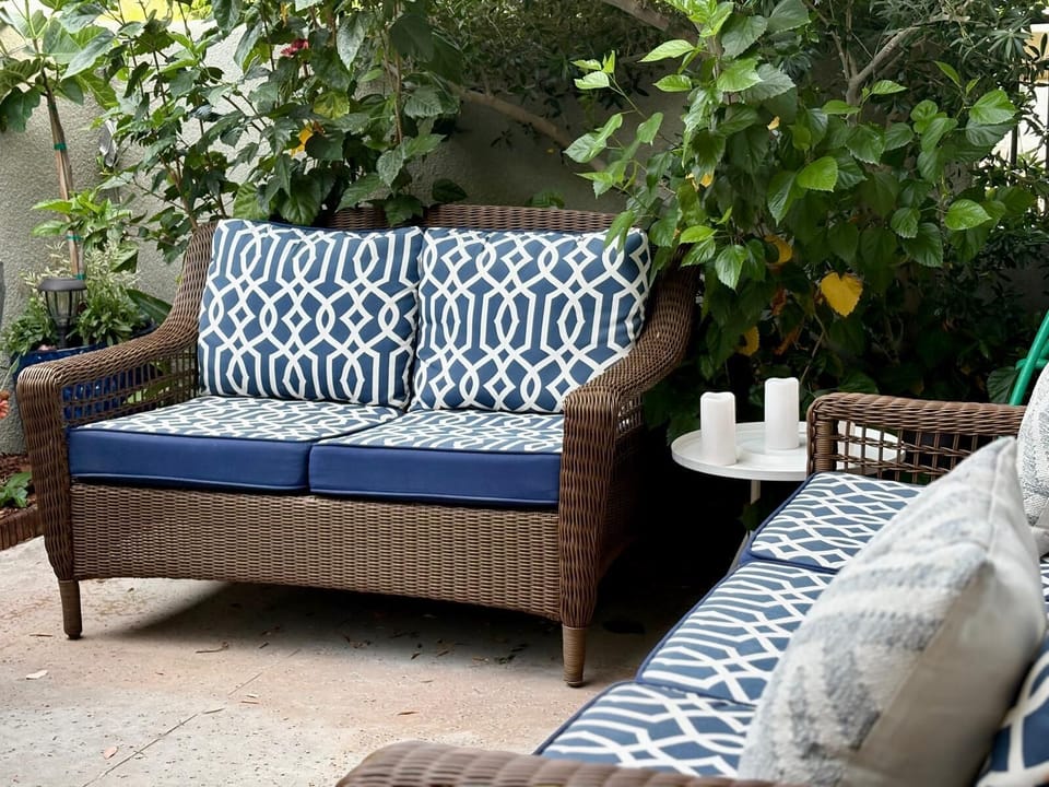 Private patio with dinning table, sofa with mountain view and grill