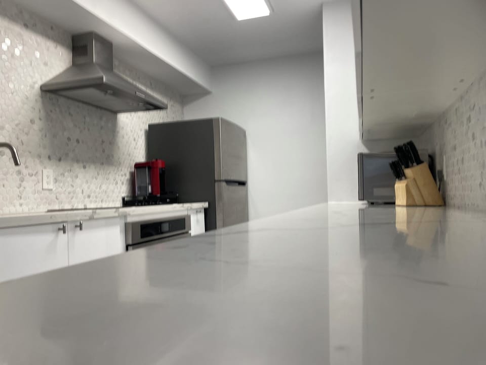 New kitchen with Nespresso coffee machine, dishwasher, washing machine and dryer