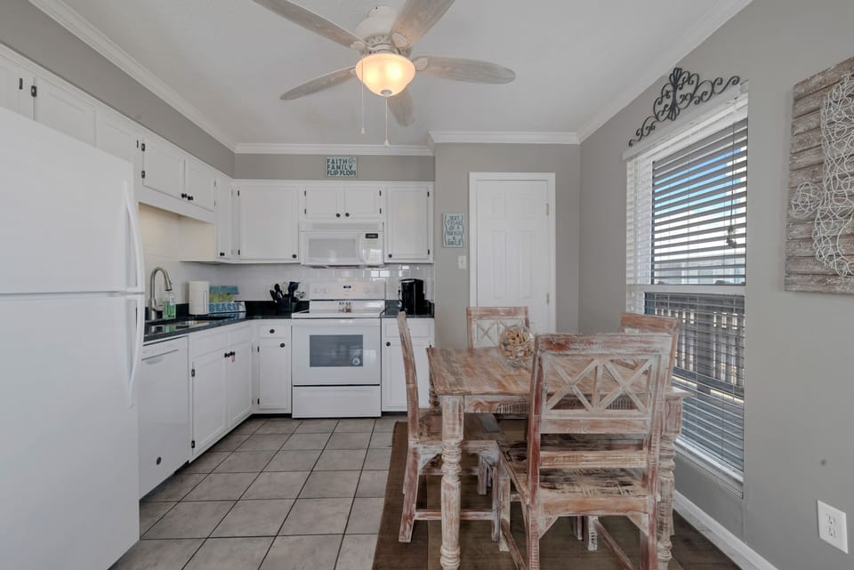 Fully stocked kitchen. Dining room table seats 4.