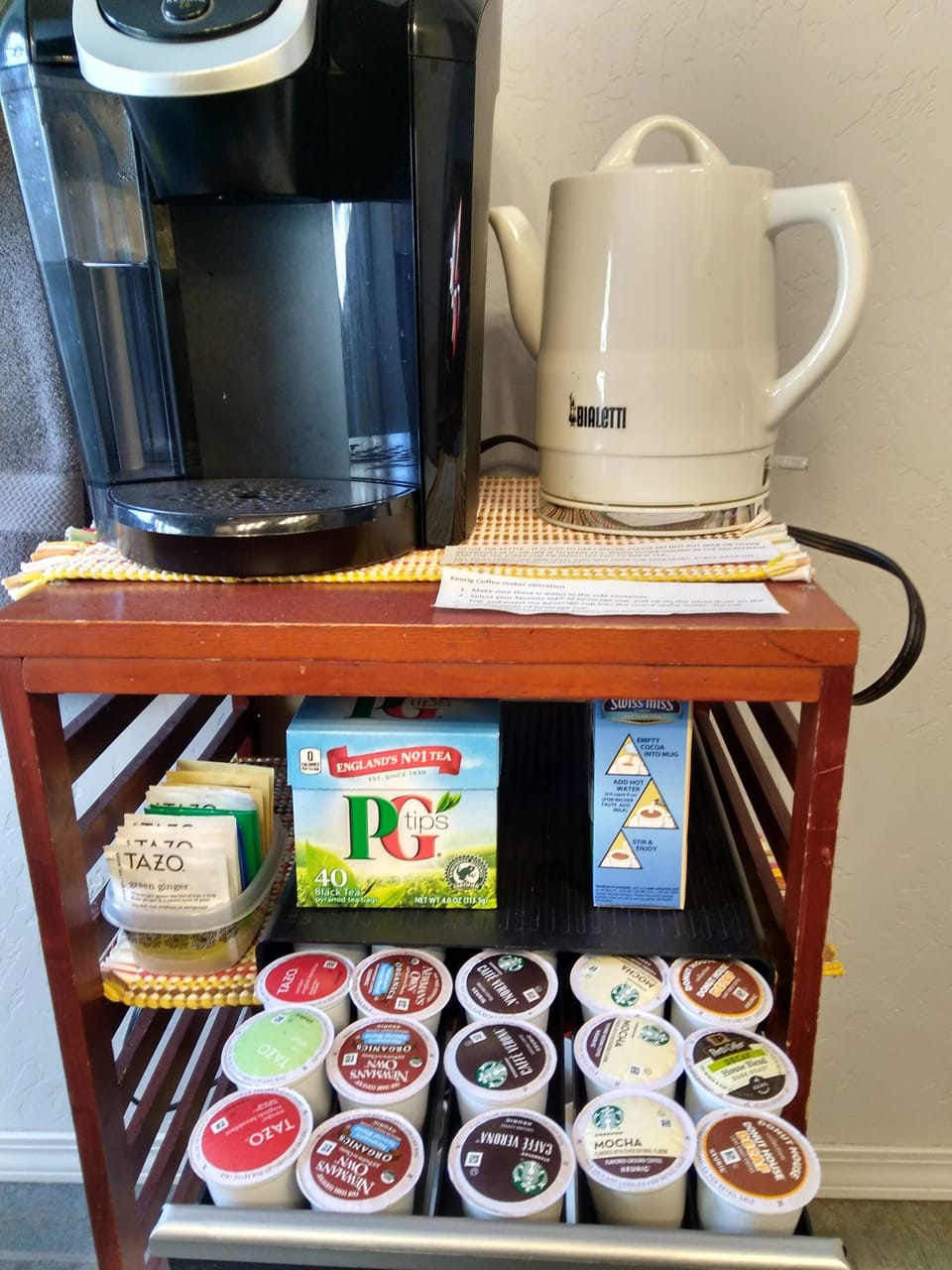 Keurig and hot water pot, traditional coffee brewer available upon request.