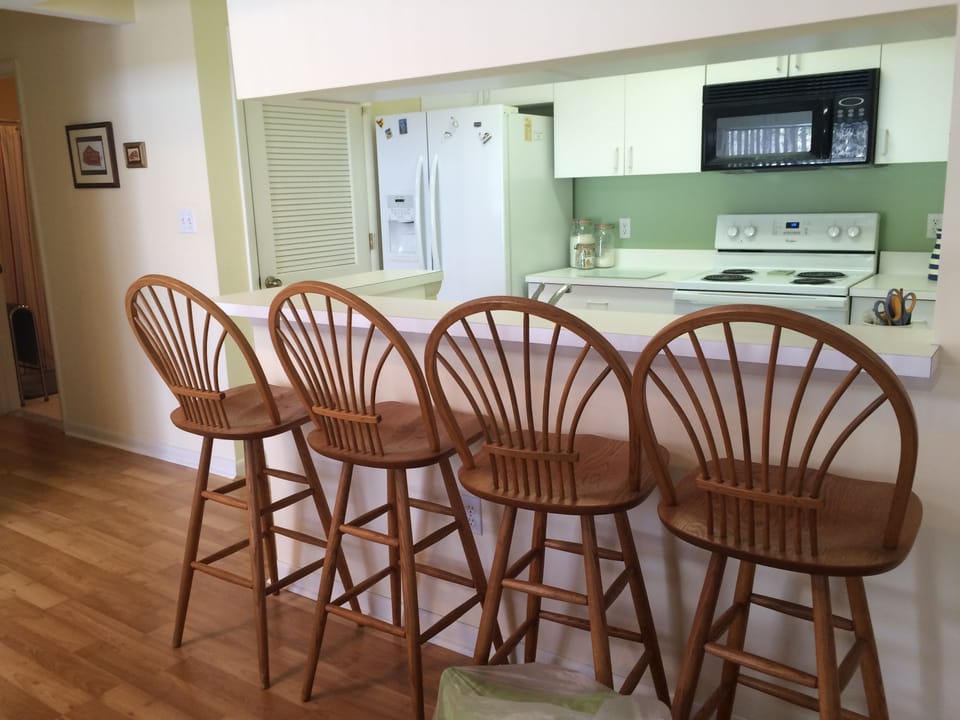 Kitchen with bar area with seating for 4