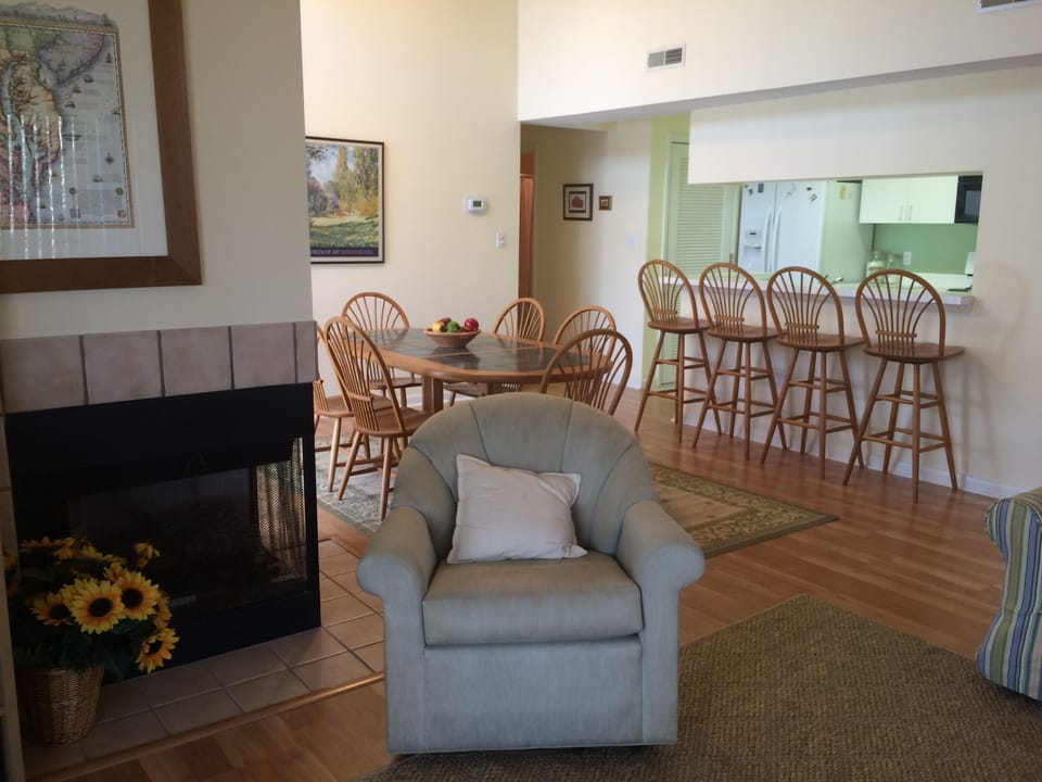 View of the living room looking into the dining and kitchen areas