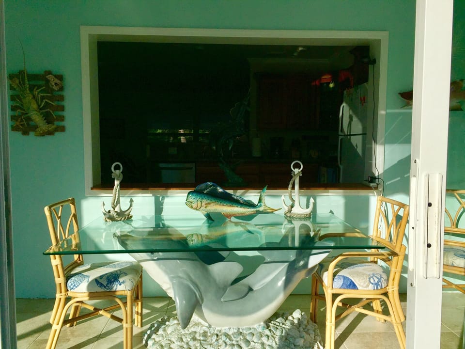 Outside looking in to the Twin Dolphin dining table
