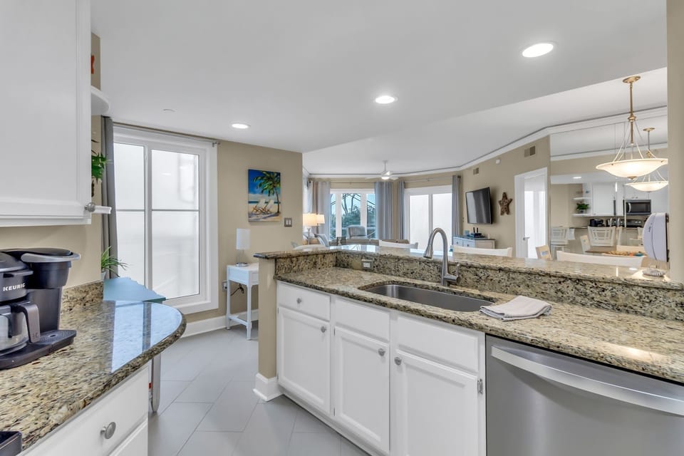 The well stocked kitchen has everything you need to prepare meals at the condo