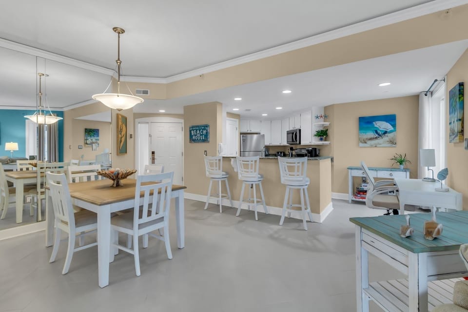 The dining area features seating for  4 with additional bar seating for 3
