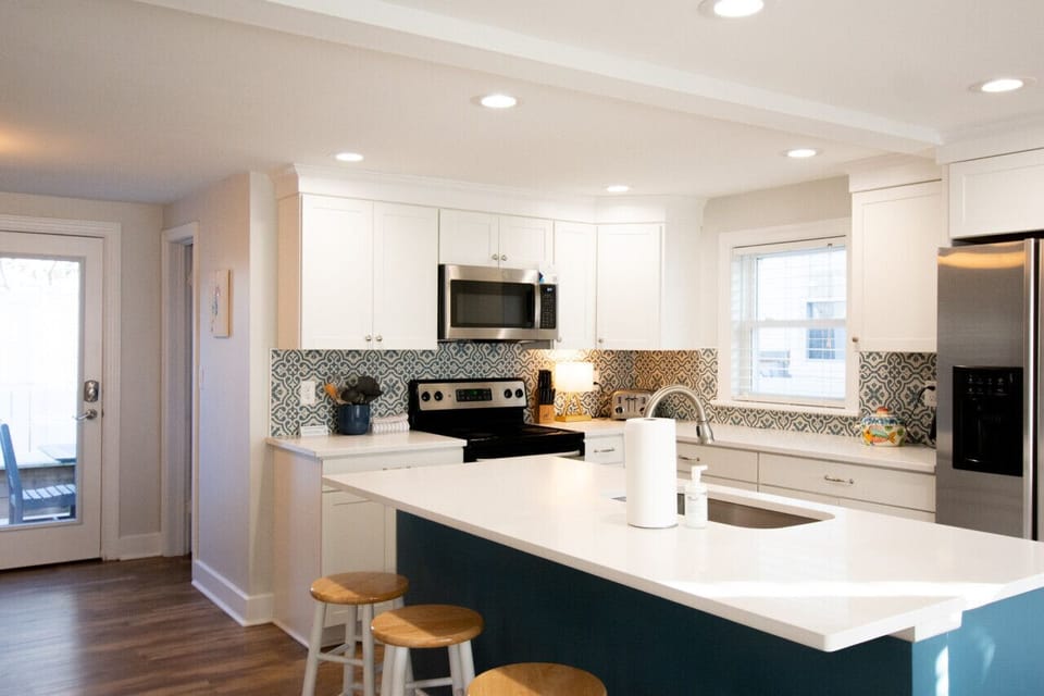 Your beautiful updated kitchen walks out to a quiet grilling and outdoor dining area.