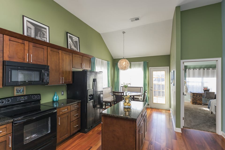 kitchen bar, island, and dining area stock with everything you need to cook!