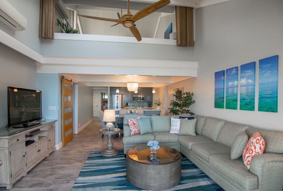 Upstairs Master Suite (with privacy screen) overlooks Living Room.