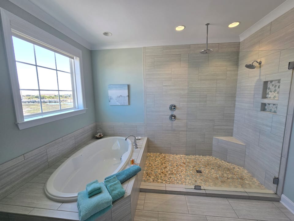 Primary bath with lots of options and a view.