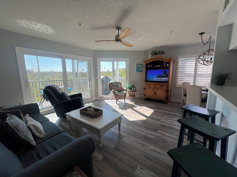 Living Room w/ Screened Balcony & Open Balcony