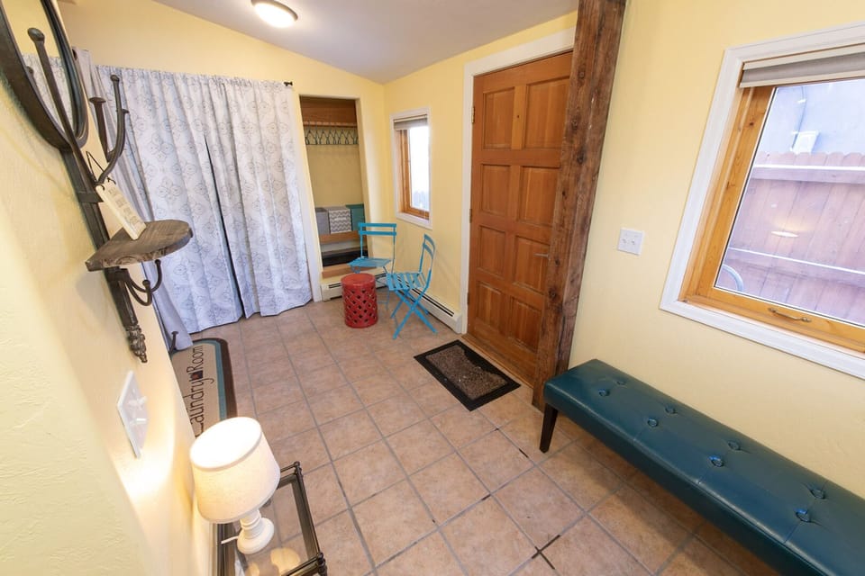 You enter on the 1st floor into a mudroom and laundry area