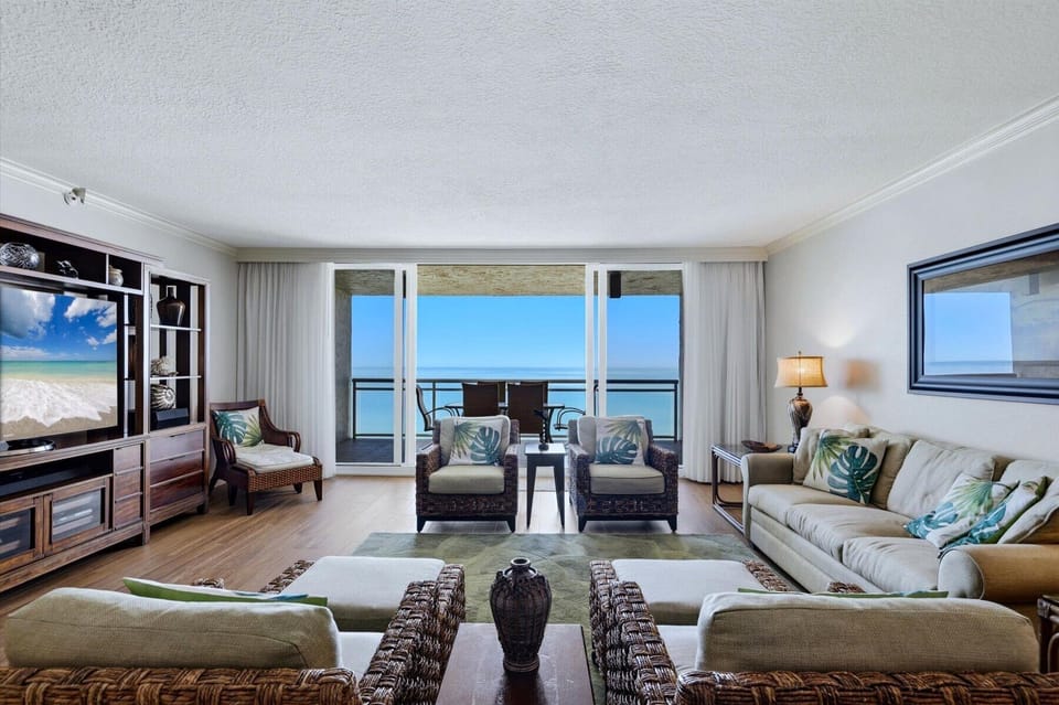 Sink into plush seating while tropical ocean views fill your windows, creating your perfect seaside sanctuary.
