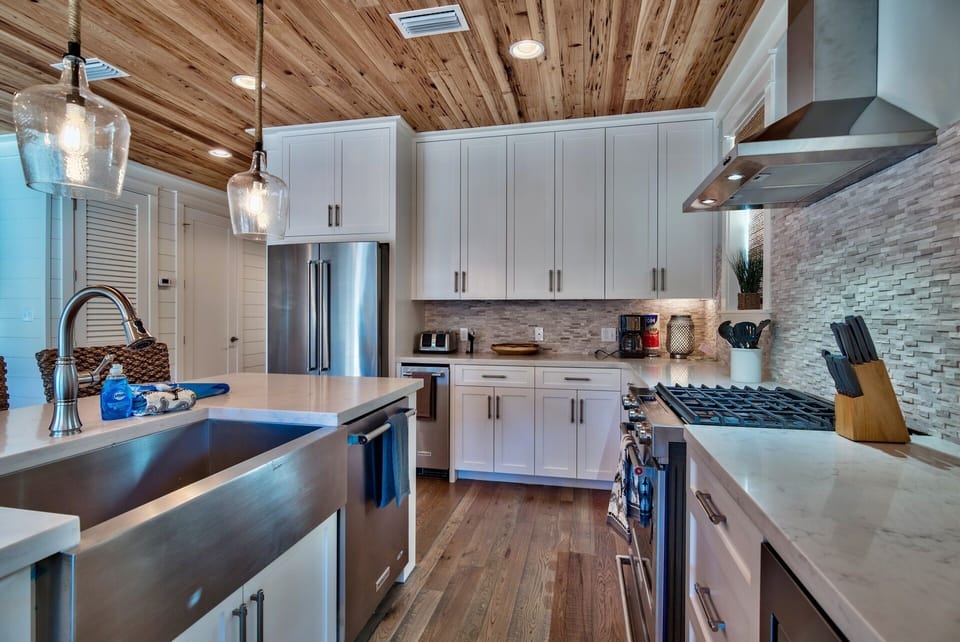 2nd floor Kitchen. Quartz countertops. "Barn" sink. Nice backsplash.  Ice maker.