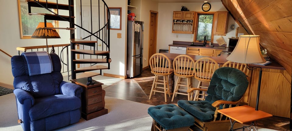Full kitchen, livingroom, spiral stairs to loft