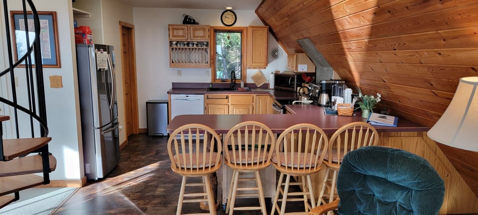 Full kitcehn and spiral stairs to loft