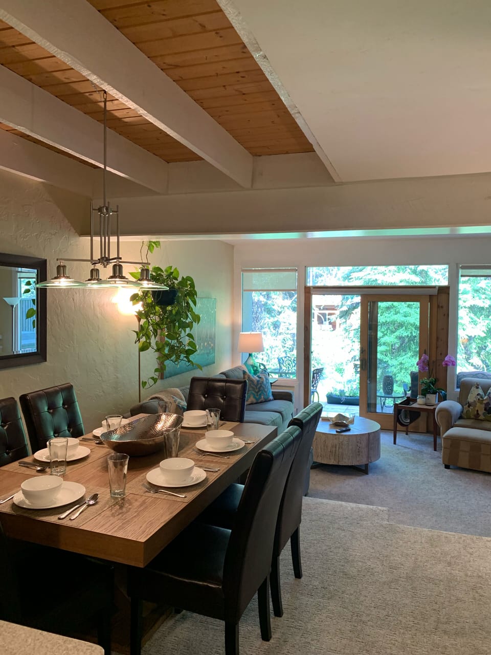 Dining area with view to window wall in living room