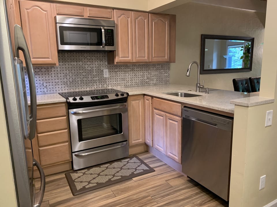 Dishes, small appliances, cookware and utensils provided for easy meal prep