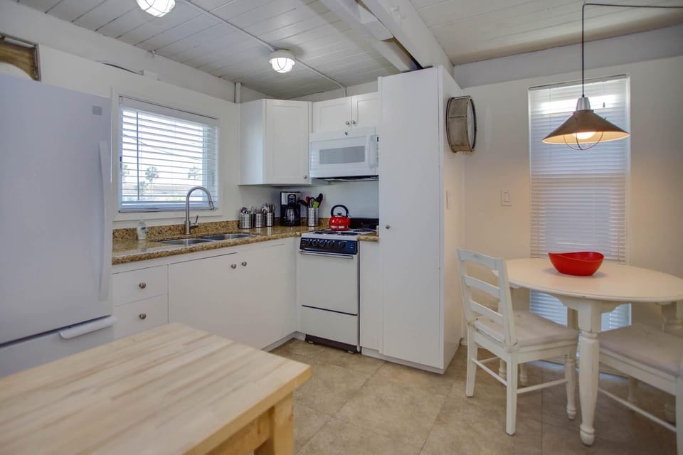 The kitchen comes stocked with dishes, glassware, utensils, cookware, bakeware, and large and small appliances. There is also a small breakfast table for 2.
                
