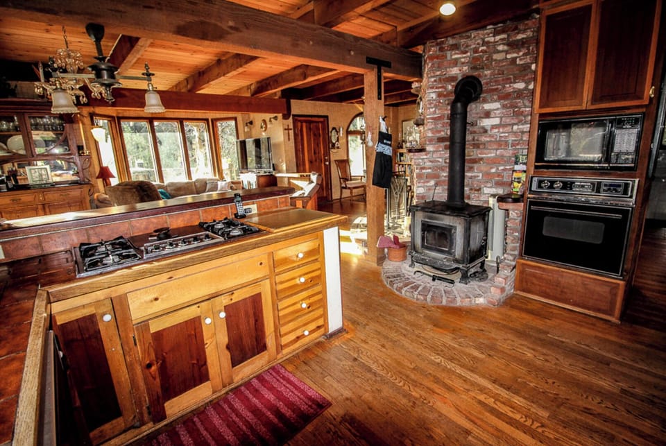 view from well equipped kitchen towards living room, permits easy conversation 