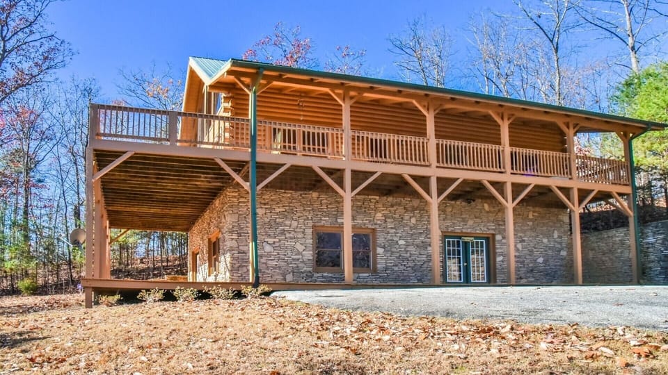 Paved driveway, entry door, & covered decks on both levels