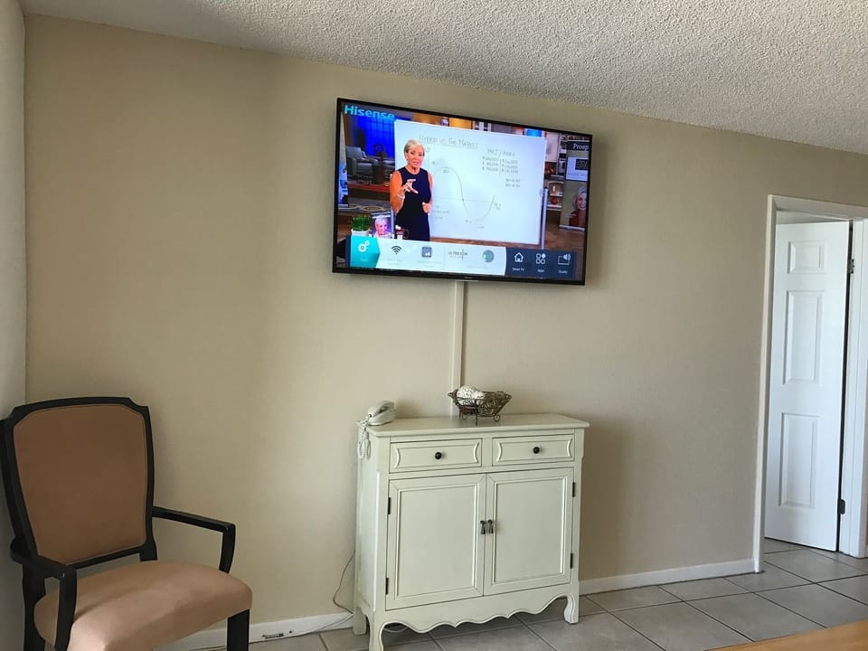 View in living room with 60 inch flatscreen TV