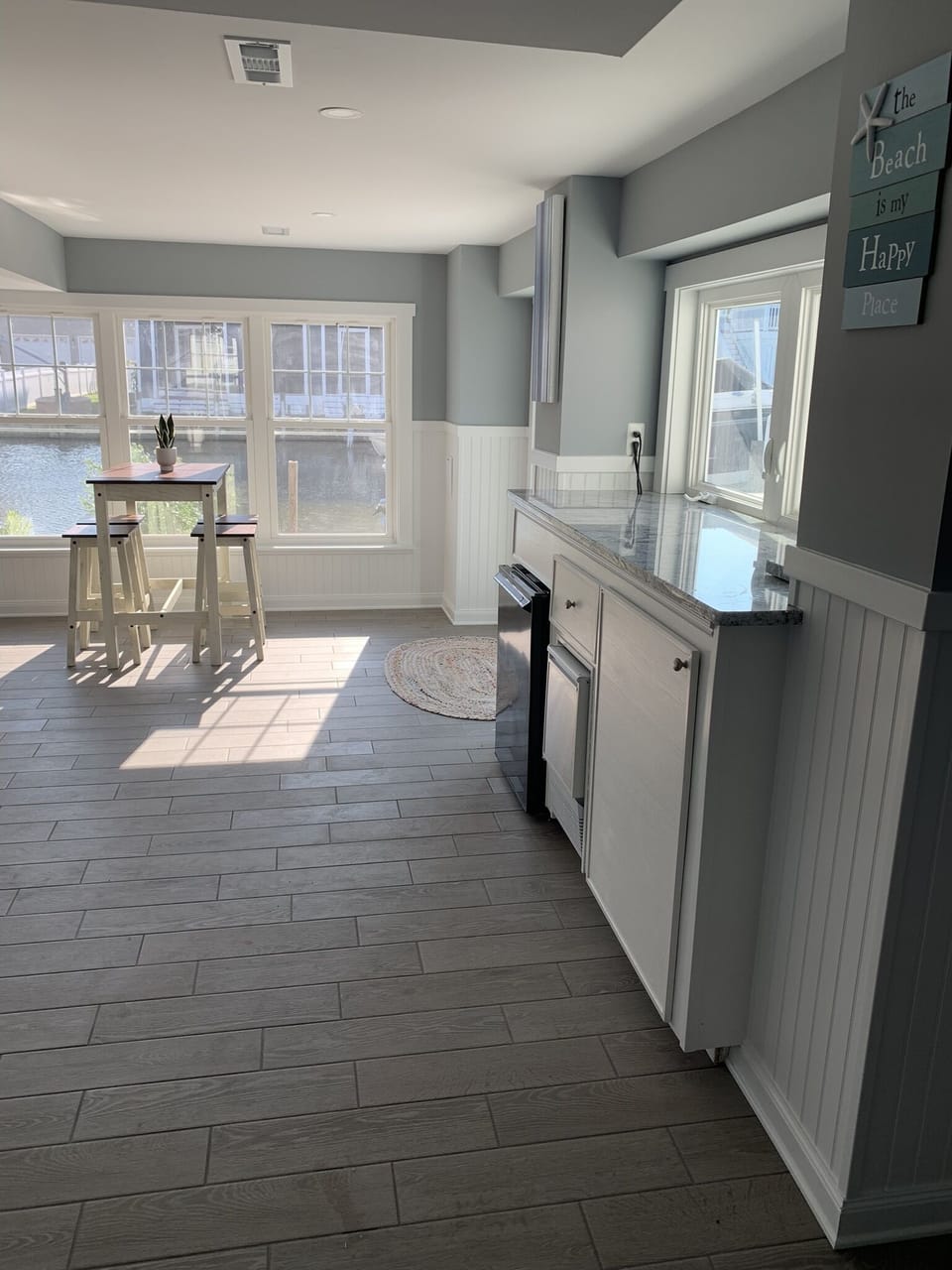 Basement. Small fridge. Ice maker. Sink.