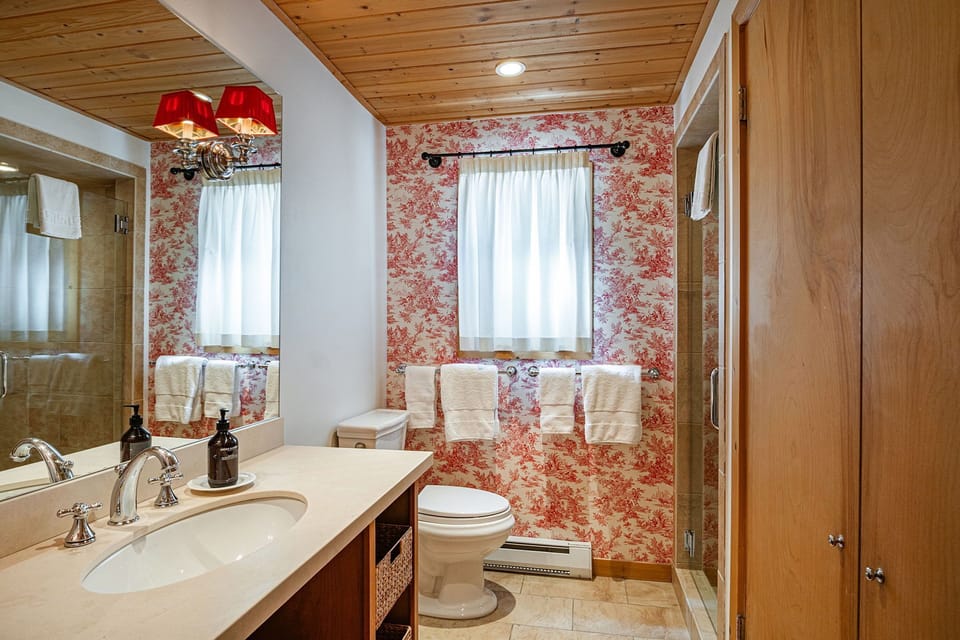 A matching French red toile bathroom.