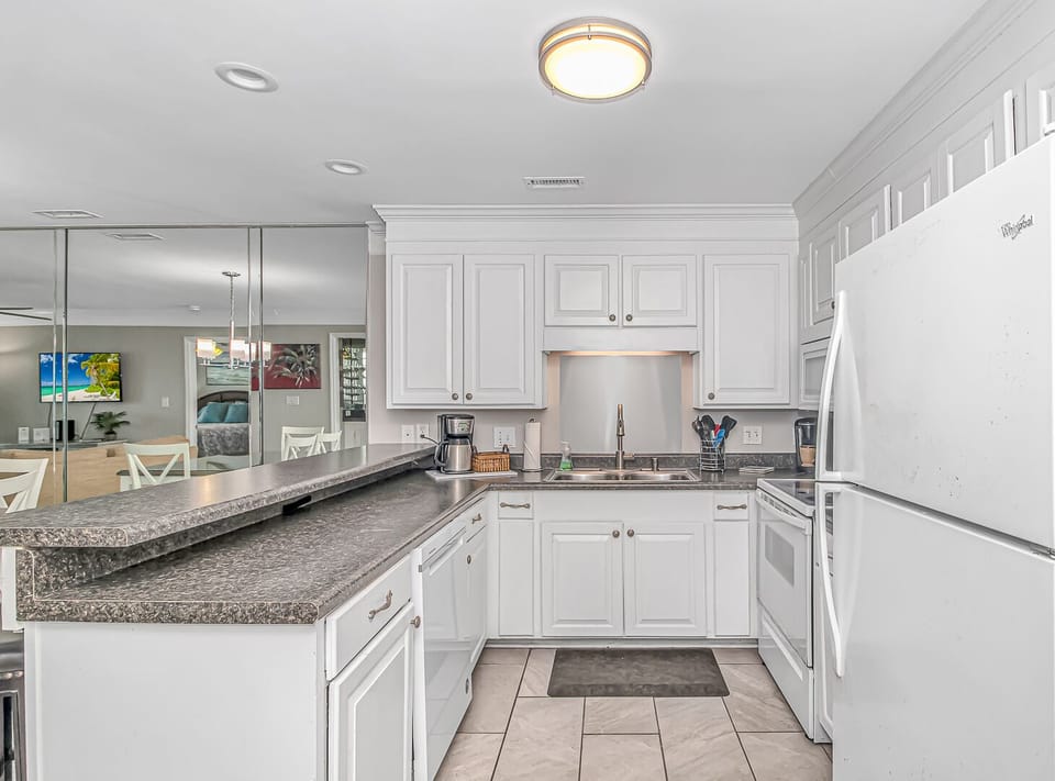 Fully stocked kitchen! Plenty of silverware, cups, and dishes. 