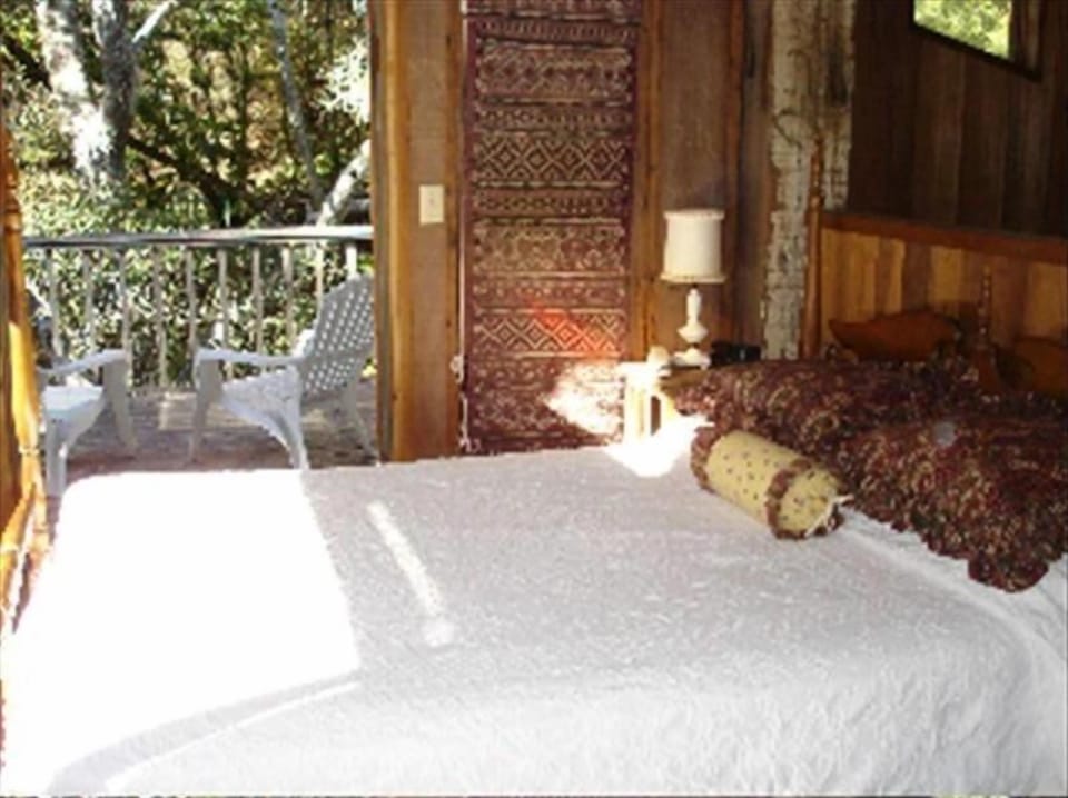 Master Bedroom with balcony over stream