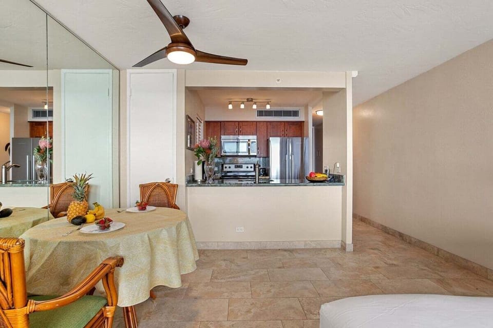 Enjoy meals in a charming dining area with tropical accents and direct access to the kitchen