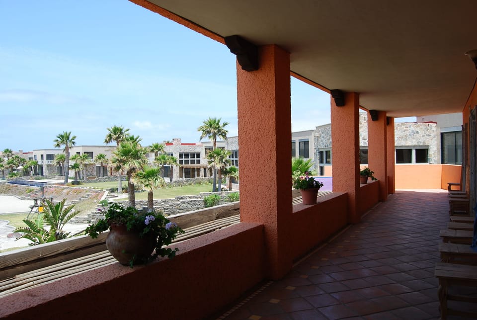 Upstairs Patio. Each of the 4 bedrooms has double door access to view the ocean.
