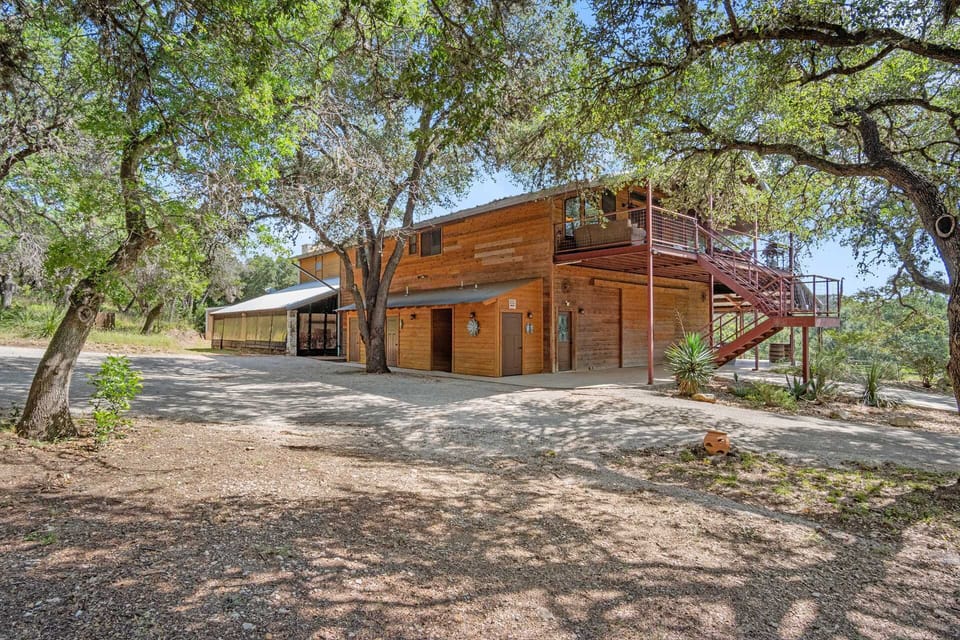 Rustic charm meets modern comfort in this peaceful woodland retreat-perfect for a serene getaway under the Texas sun.