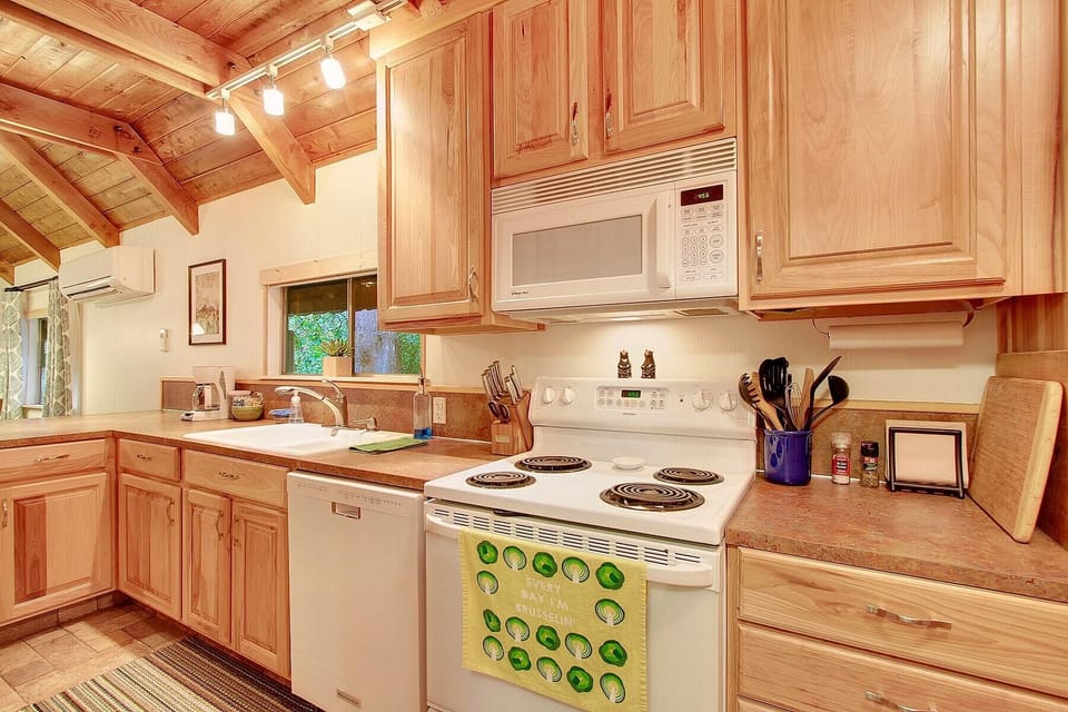 Kitchen includes full-size fridge, oven/stove, microwave, dishwasher & new sink.