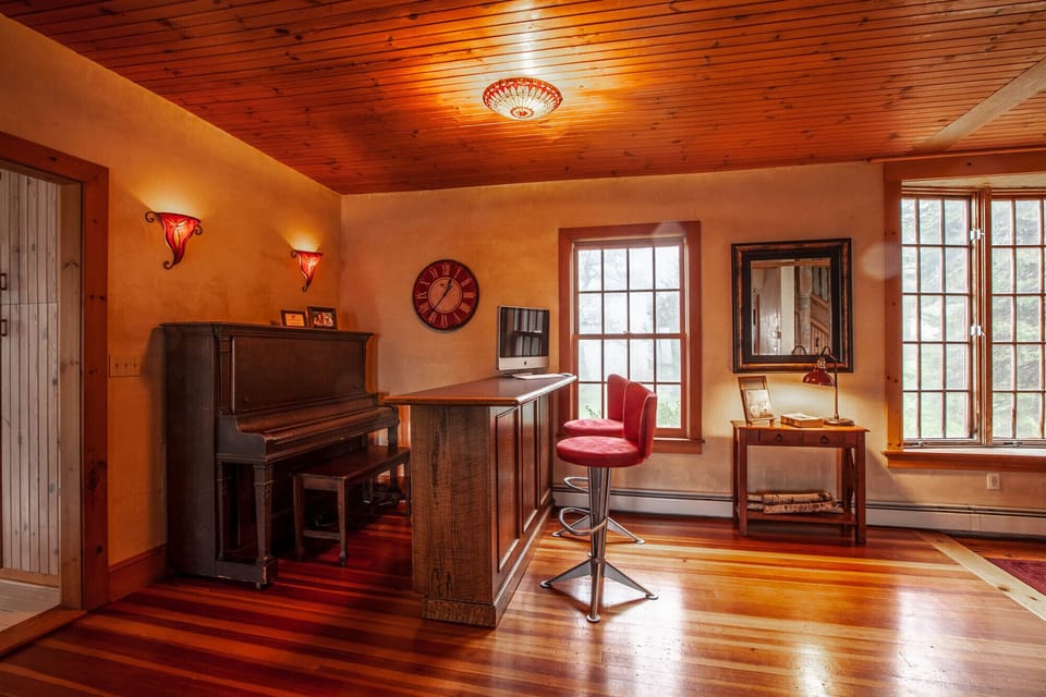 Piano Bar with Bose Bluetooth Sound System stocked with plenty of wine glasses