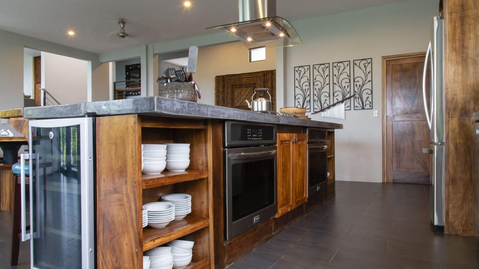 This kitchen is modern and fully equipped with everything you need.