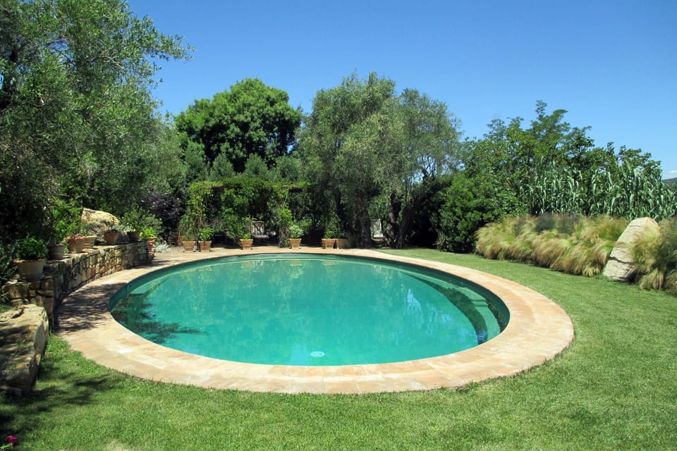 Villa's oval shaped Private Swimming Pool (8 x 15 meters, 26 x 50 feet)