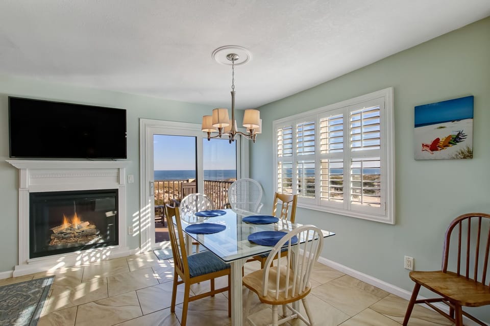 Dining Space with Table Seating for Six and Balcony Access