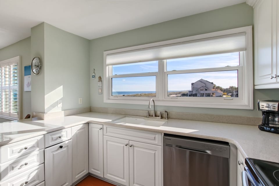 Updated and Fully Equipped Kitchen with Granite Countertops and Stainless Steel Appliances