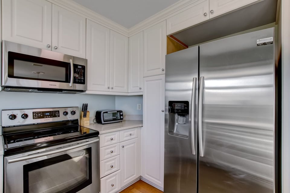 Updated and Fully Equipped Kitchen with Granite Countertops and Stainless Steel Appliances