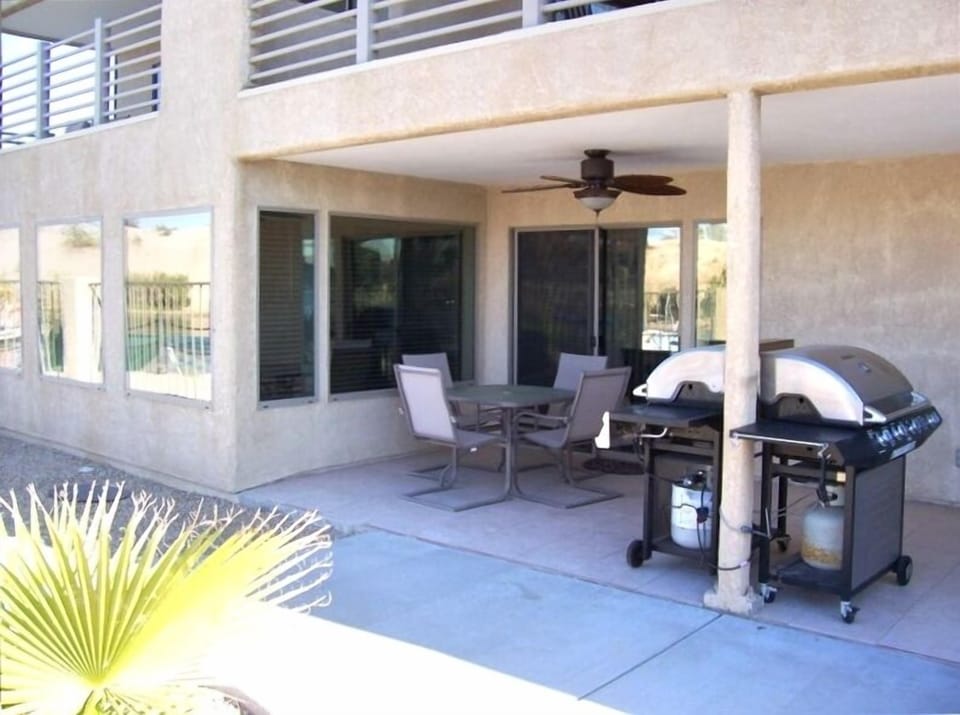 SPECTACULAR PATIO OFF GUEST MASTER WITH DINING AND STAINLESS BARBEQUE AND FANS
