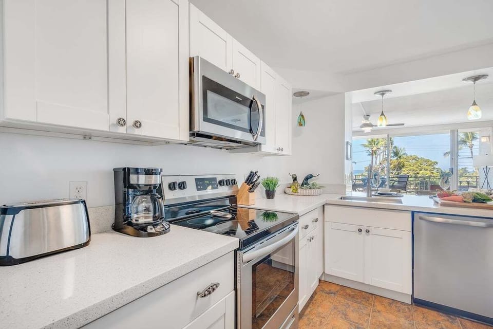 Prepare your meal in this spacious kitchen while enjoying the view outdoor