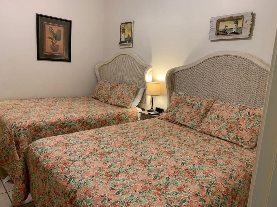 Second bedroom has two queen sized beds.