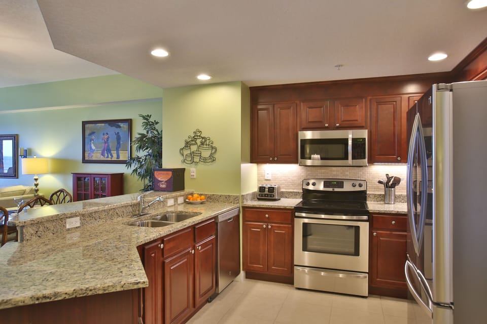 Well stocked gourmet kitchen with views of the ocean and even a coffee grinder! 
