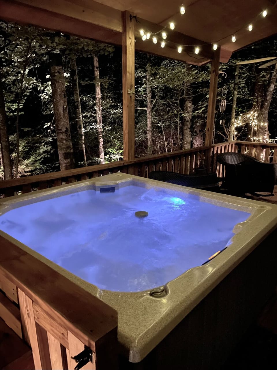 Melt In The Warm Therapeutic Waters Of The Spacious Hot Tub Surrounded By Trees