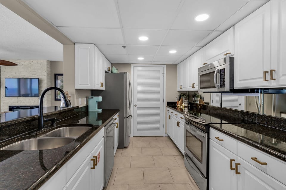 Upgraded cabinetry, granite counters, stainless appliances