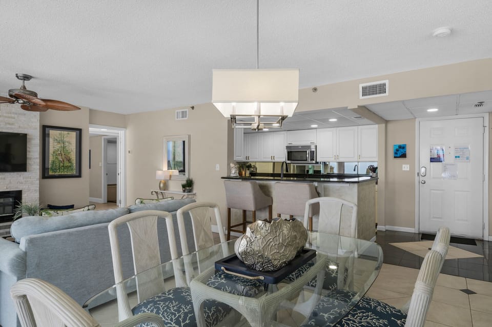 Alternative view of dining area and kitchen as seen from window side