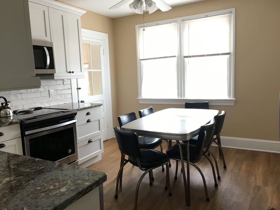 Entry into the kitchen and table and chairs.