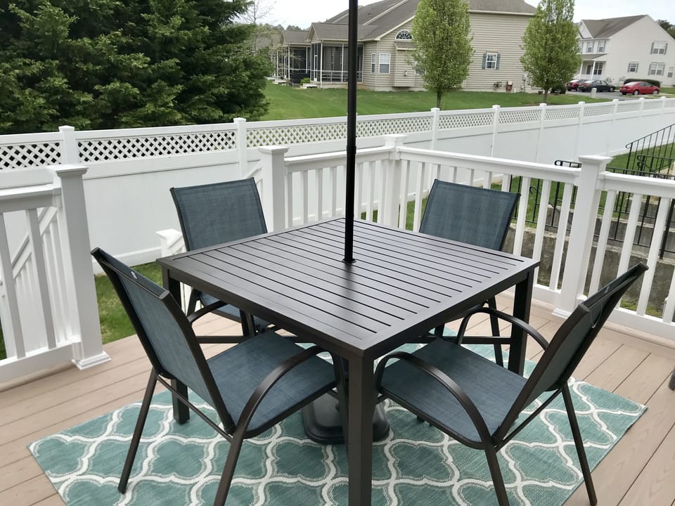 Morning sun/ afternoon shade. Great for barbecuing on a propane/charcoal grill. 